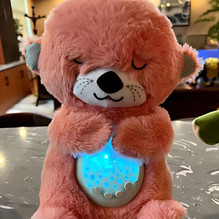 Sovende oter kosedyr med nattlys