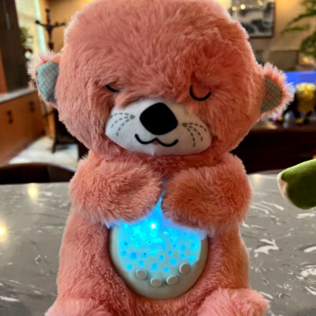 Sovende oter kosedyr med nattlys