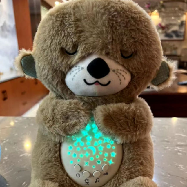 Sovende oter kosedyr med nattlys