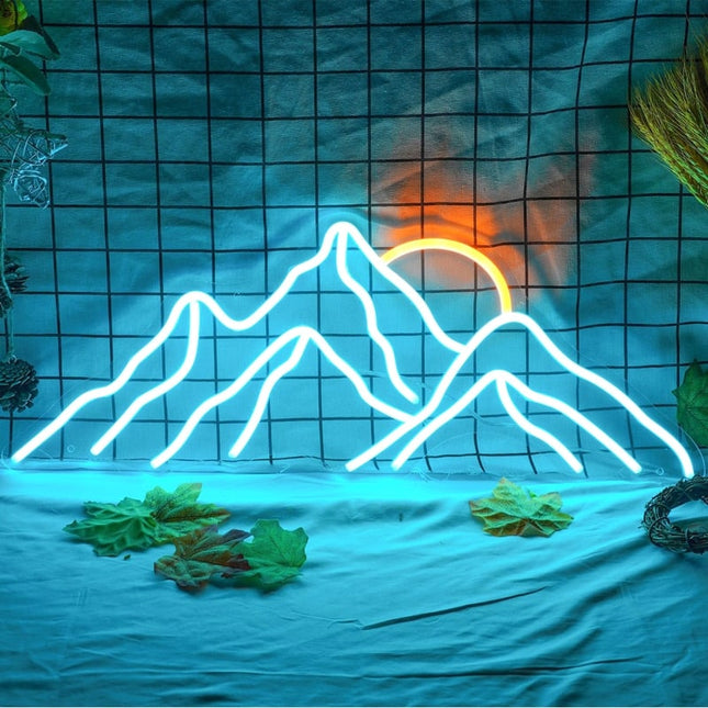 Neon vegglampe med fjellmotiv og solnedgang