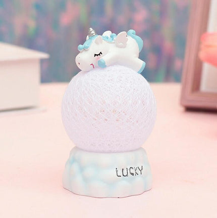 Nattlys enhjørning på rosa eller blå ball