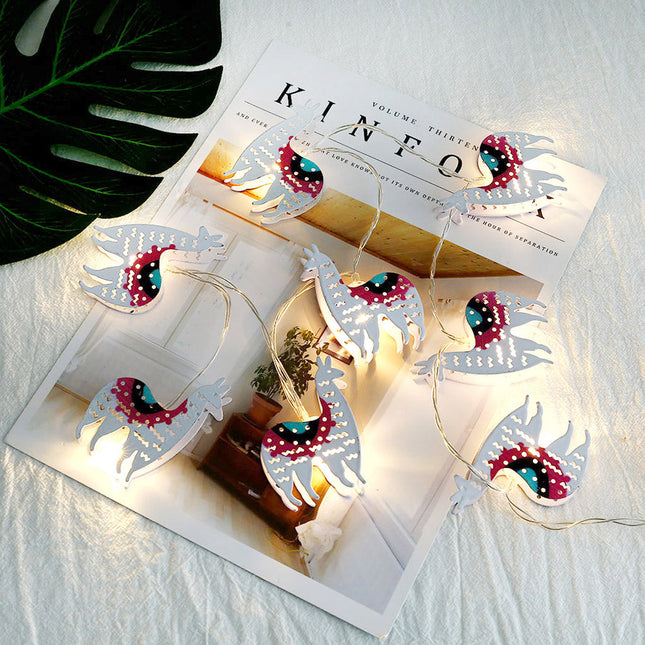 Dekorativ lyslenke med lama figurer