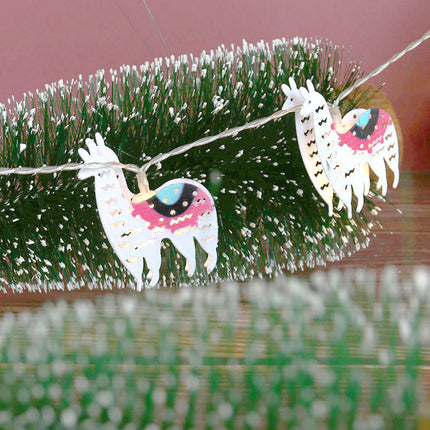 Dekorativ lyslenke med lama figurer