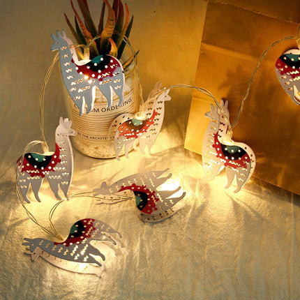 Dekorativ lyslenke med lama figurer